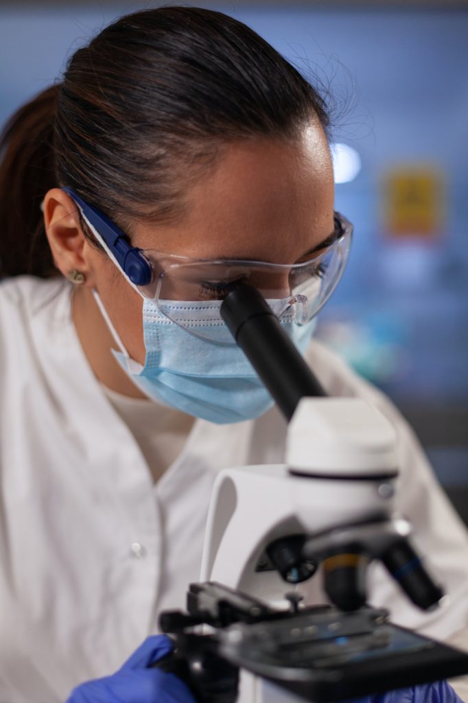 Woman with medical researcher occupation in laboratory